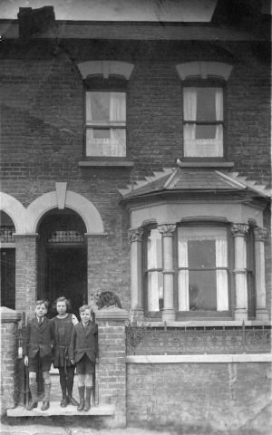 St. John's Terrace, Plumstead, with Stan, Grace and Fred Smith taken in 1923. Lily Smith married Stan on the left of the picture, they were sister and brothers. 
Photo:John Miles
